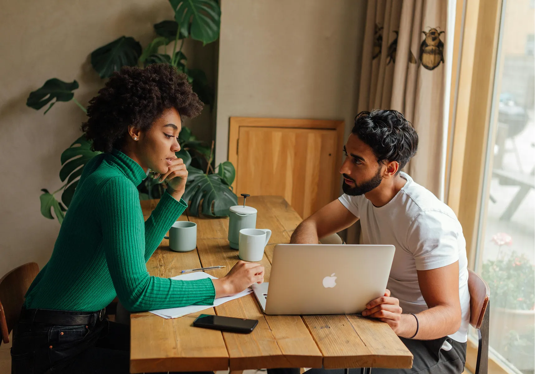 Working through paperwork together at the kitchen table